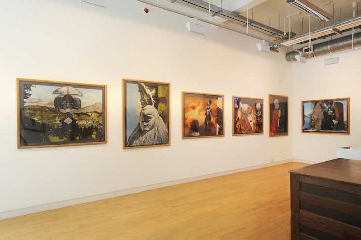A view of a gallery showing six large format framed photographs of collage works showing a mixture of landscapes and African sculptures